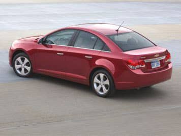 Despite the long, fluid arc of the roof design, the car is still airy inside. Typically when manufacturers attempt a "coupe design" for sedans they end up sacrificing headroom. The Cruze seems to avoid this with ample space. One last thing: Do you notice a little bit of BWM's 3-series sedan in the tail light design?Read More Chevy CruzeIn Pictures: Chevy CruzeGM Invests in Ohio to Build New Compact CruzeTwenty Cars Of The Future