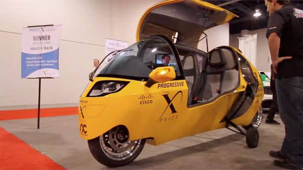 The Peraves E-Tracer is an electric powered vehicle. Technically, it's a motorcycle, but it does have an enclosed body and seating for two people. Based on the gasoline powered Monotracer, the X-Tracer team won a $2.5 million X-Prize award in the Alternative Tandem class. X-Prize winners were required to build production capable cars that achieve 100 mpg or the electric equivalent. Peraves says the E-Tracer's goal is to provide a zero-emissions vehicle that's able to carry two passengers and a weekend's worth of luggage. Top speed is 120 mph but the company says it wants to build a high performance version capable of 200 mph. E-Tracer range is about 150 miles from its 200 pounds of batteries.