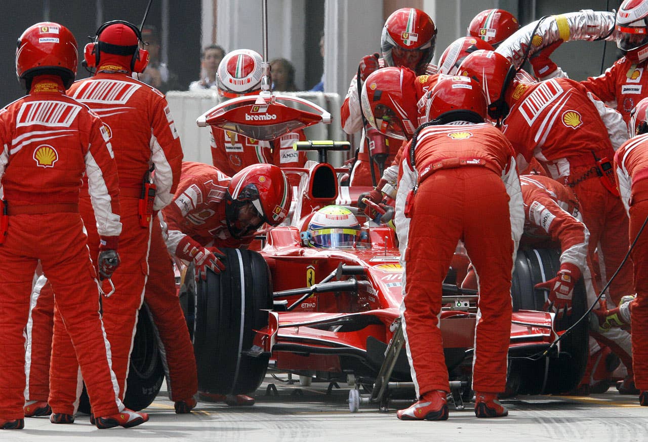 Ferrari Brazilian's driver Felipe Massa pits stop at the Istanbul Park racetrack on May 11, 2008 in Istanbul, during the Formula One Turkish Grand Prix. Massa won the race ahead of McLaren Mercedes' British driver Lewis Hamilton and Ferrari's Finnish driver Kimi Raikkonen. AFP PHOTO / POOL / TOLGA BOZOGLU (Photo credit should read TOLGA BOZOGLU/AFP/Getty Images)