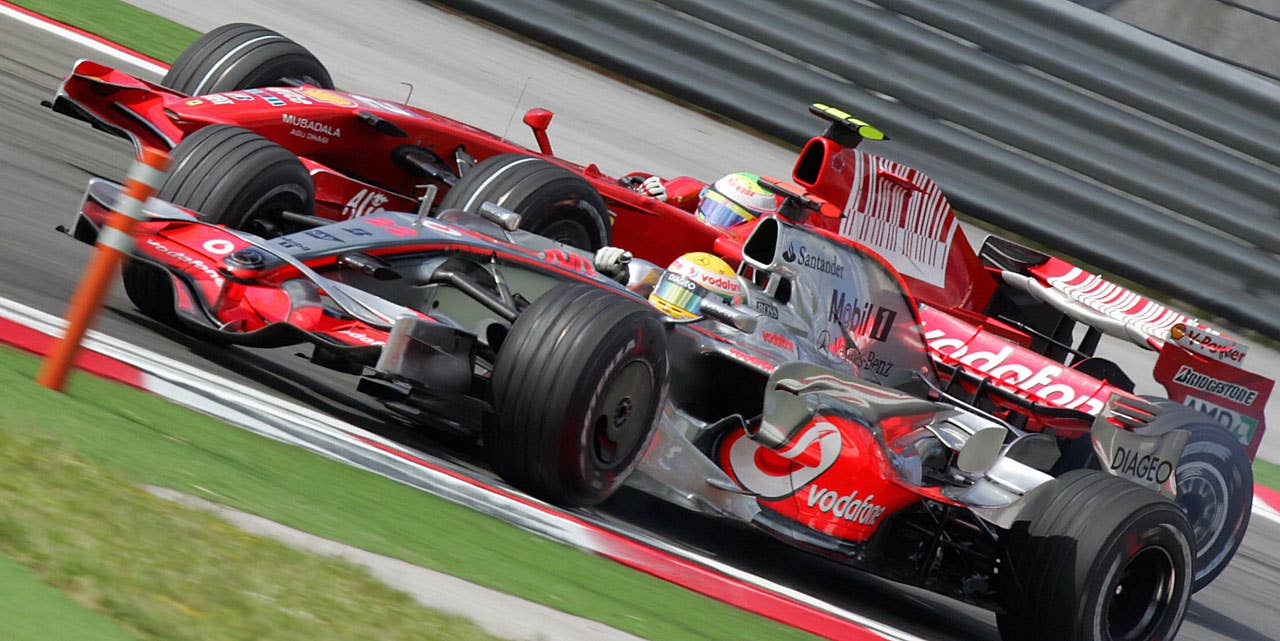Ferrari Brazilian's driver Felipe Massa tries to overtake McLaren Mercedes' British driver Lewis Hamilton at the Istanbul Park racetrack on May 11, 2008 in Istanbul, during the Formula One Turkish Grand Prix. Massa won the race ahead of McLaren Mercedes' British driver Lewis Hamilton and Ferrari's Finnish driver Kimi Raikkonen. AFP PHOTO / HUSEYIN CAGLAR (Photo credit should read HUSEYIN CAGLAR/AFP/Getty Images)