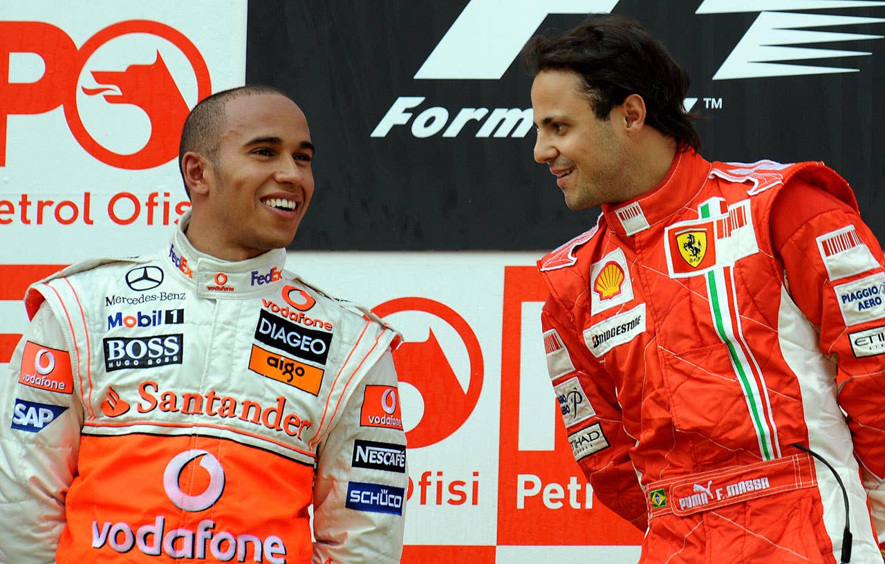 Ferrari Brazilian's driver Felipe Massa (R) chats with McLaren Mercedes' British driver Lewis Hamilton on the podium the Formula One Turkish Grand Prix at the Istanbul Park racetrack on May 11, 2008 in Istanbul. Ferrari Brazilian's driver Felipe Massa won the race ahead of McLaren Mercedes' British driver Lewis Hamilton and Ferrari's Finnish driver Kimi Raikkonen. AFP PHOTO / BERTRAND GUAY (Photo credit should read BERTRAND GUAY/AFP/Getty Images)
