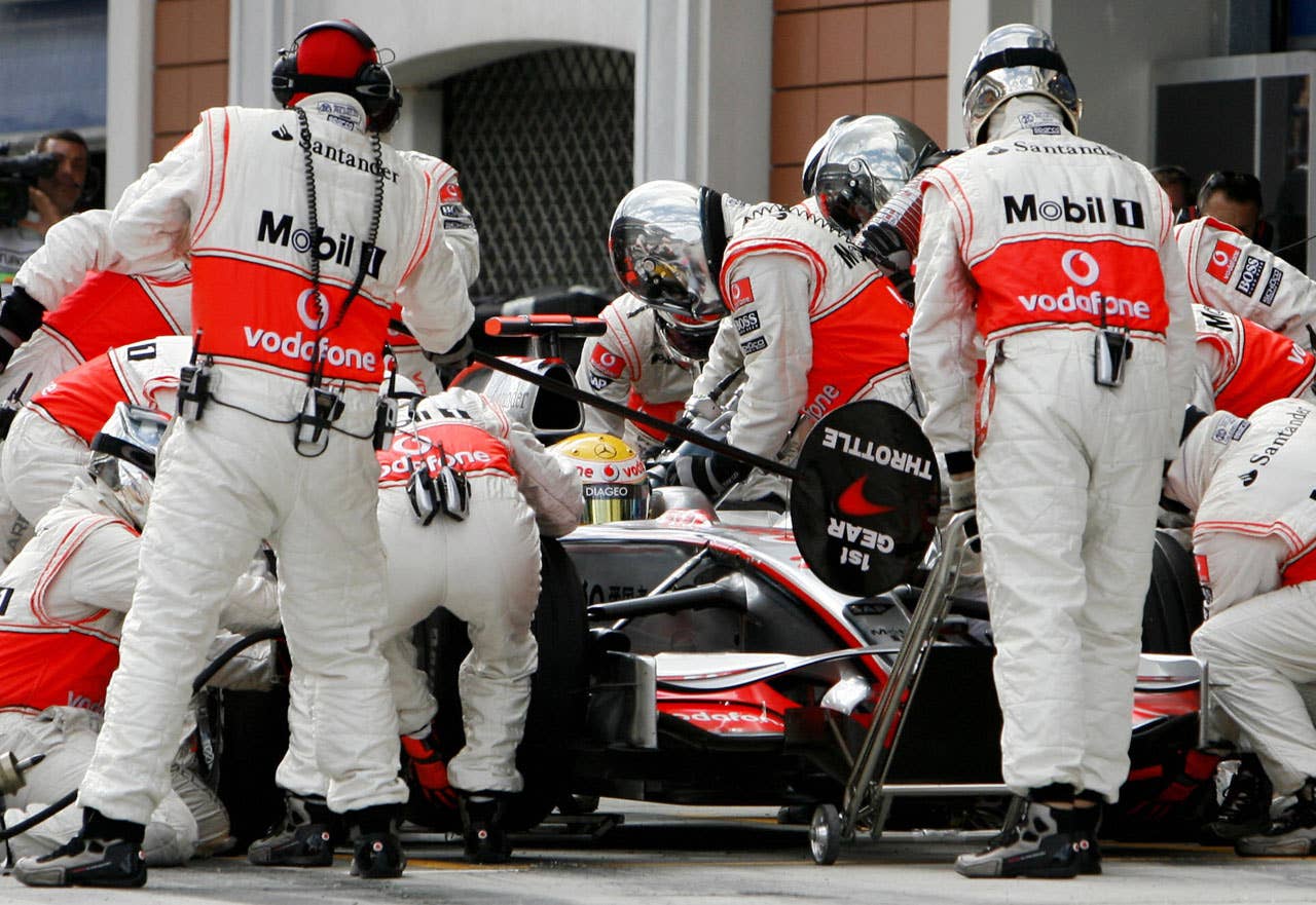 McLaren Mercedes' British driver Lewis Hamilton pits stop at the Istanbul Park racetrack on May 11, 2008 in Istanbul, during the Formula One Turkish Grand Prix. Ferrari Brazilian's driver Felipe Massa won the race ahead of McLaren Mercedes' British driver Lewis Hamilton and Ferrari's Finnish driver Kimi Raikkonen. AFP PHOTO / POOL / TOLGA BOZOGLU (Photo credit should read TOLGA BOZOGLU/AFP/Getty Images)