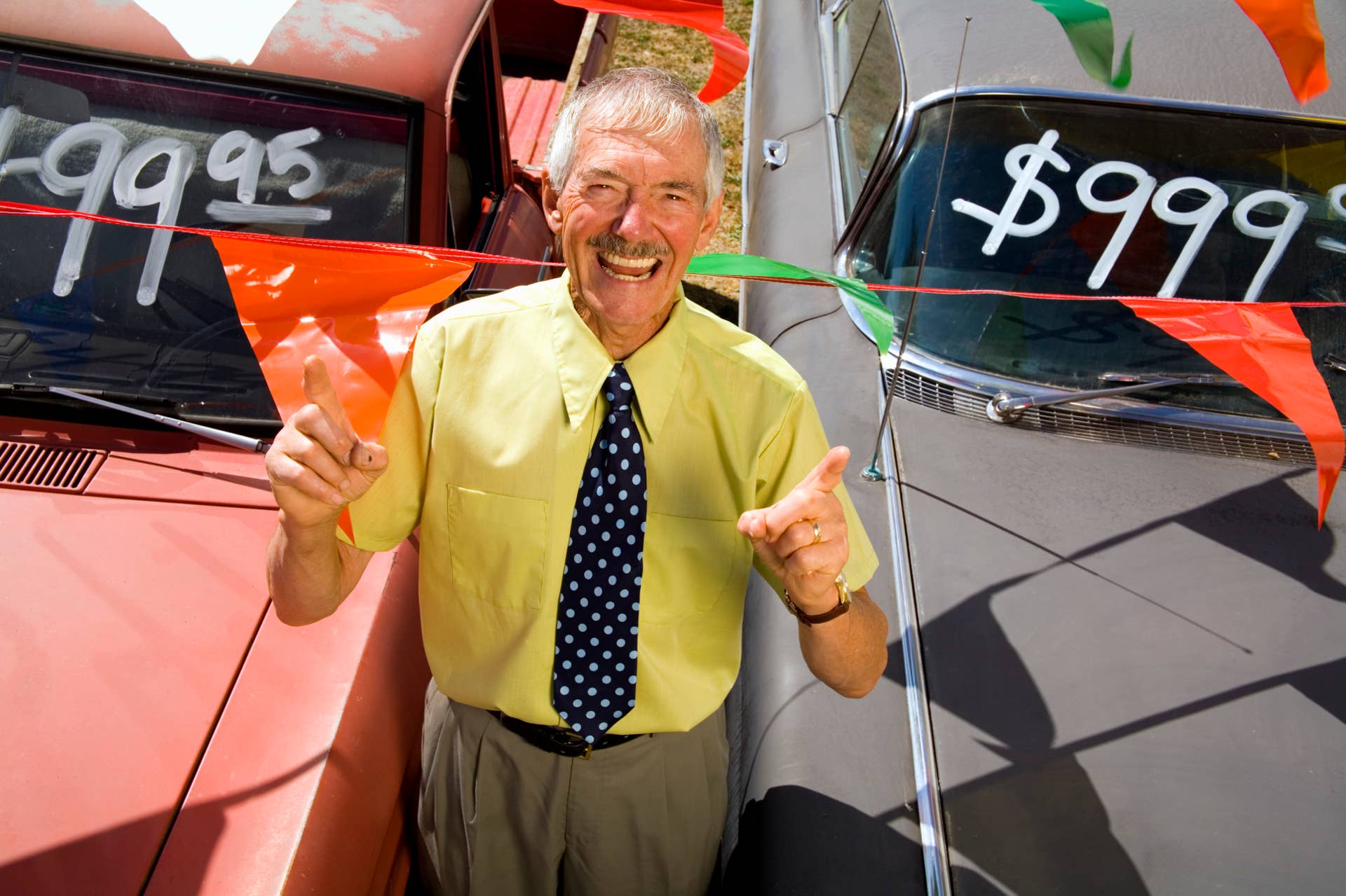 Used car salesman and cars