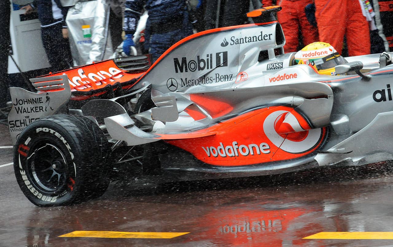 McLaren Mercedes' British driver Lewis Hamilton enters with a flat tire in the pits of the Monaco racetrack on May 25, 2008 in Monte Carlo, during the Monaco Formula One Grand Prix. McLaren Mercedes' British driver Lewis Hamilton won the race ahead of BMW Sauber's Polish driver Robert Kubica and Ferrari Brazilian's driver Felipe Massa. AFP PHOTO / POOL / PASCAL GUYOT (Photo credit should read PASCAL GUYOT/AFP/Getty Images)