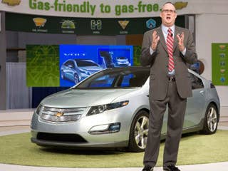 The production version of the Volt, shown here, is more sedan-like. Here General Motors North America Vice President Chevrolet Ed Peper stands with the Chevy Volt electric vehicle.Research Alternative Fuel VehiclesCan the Volt Get 230 MPG?Alternative Fuel Buying GuideElectric Vehicles