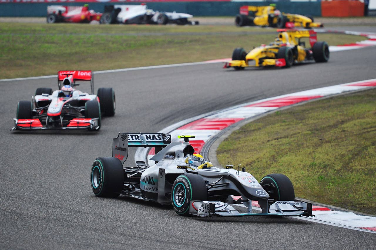 SHANGHAI, CHINA - APRIL 18:  Nico Rosberg of Germany and Mercedes GP leads from Jenson Button of Great Britain and McLaren Mercedes and Robert Kubica of Poland and Renault during the Chinese Formula One Grand Prix at the Shanghai International Circuit on April 18, 2010 in Shanghai, China.  (Photo by Clive Mason/Getty Images) *** Local Caption *** Nico Rosberg;Jenson Button;Robert Kubica