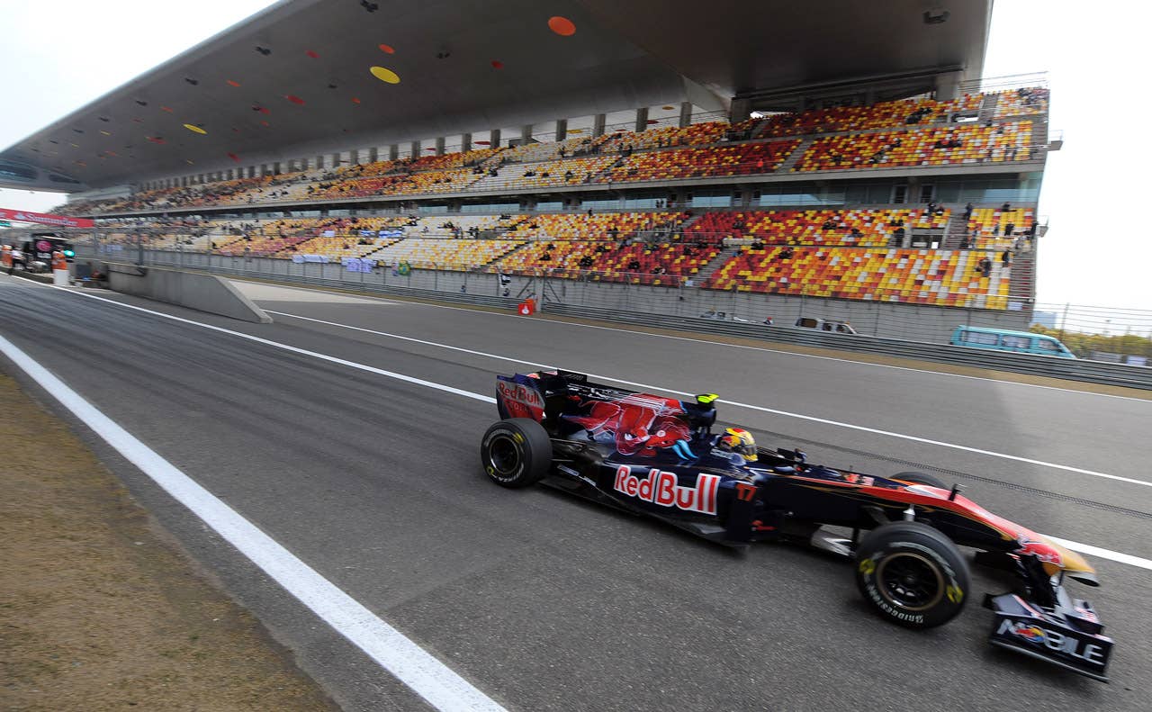 Red Bull driver Mark Webber of Australia makes his way out of the pit lane during the third qualifying session for the Formula One Chinese Grand Prix at the Shanghai International Circuit on April 17, 2010.             AFP PHOTO/GOH CHAI HIN (Photo credit should read GOH CHAI HIN/AFP/Getty Images)