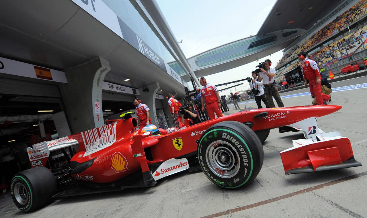 Ferrari driver Fernando Alonso of Spain takes his car out of the garage during the third qualifying session for the Formula One Chinese Grand Prix at the Shanghai International Circuit on April 17, 2010.             AFP PHOTO/GOH CHAI HIN (Photo credit should read GOH CHAI HIN/AFP/Getty Images)