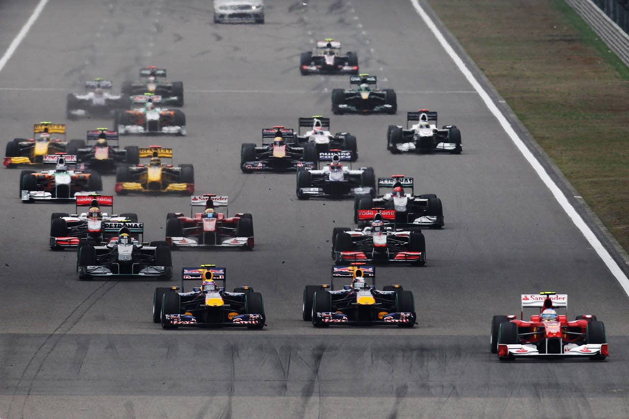 SHANGHAI, CHINA - APRIL 18:  Fernando Alonso (R) of Spain and Ferrari gets a good start to the first corner during the Chinese Formula One Grand Prix at the Shanghai International Circuit on April 18, 2010 in Shanghai, China.  (Photo by Paul Gilham/Getty Images) *** Local Caption *** Fernando Alonso