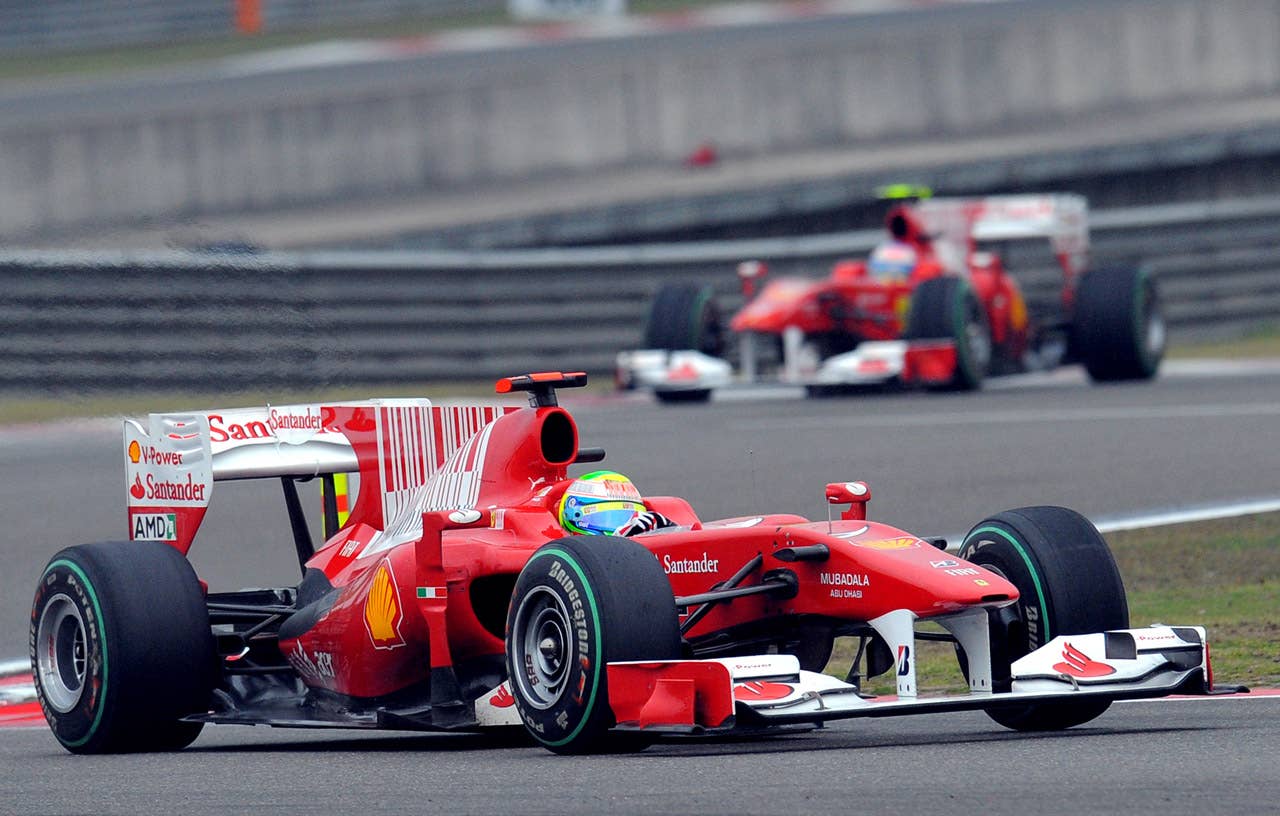 Ferrari driver Felipe Massa (L) of Brazil leads his teammate Fernando Alonso of Spain during Formula One's Chinese Grand Prix in Shanghai on April 18, 2010. Massa finished in ninth, while Alonso ended in fourth.   AFP PHOTO/GOH CHAI HIN (Photo credit should read GOH CHAI HIN/AFP/Getty Images)