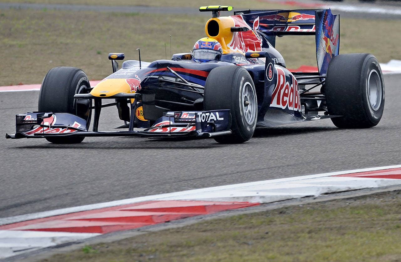 Red Bull-Renault driver Mark Webber of Australia powers his car during Formula One's Chinese Grand Prix in Shanghai on April 18, 2010. Webber finished the race in eighth place.  AFP PHOTO / PHILIPPE LOPEZ (Photo credit should read PHILIPPE LOPEZ/AFP/Getty Images)