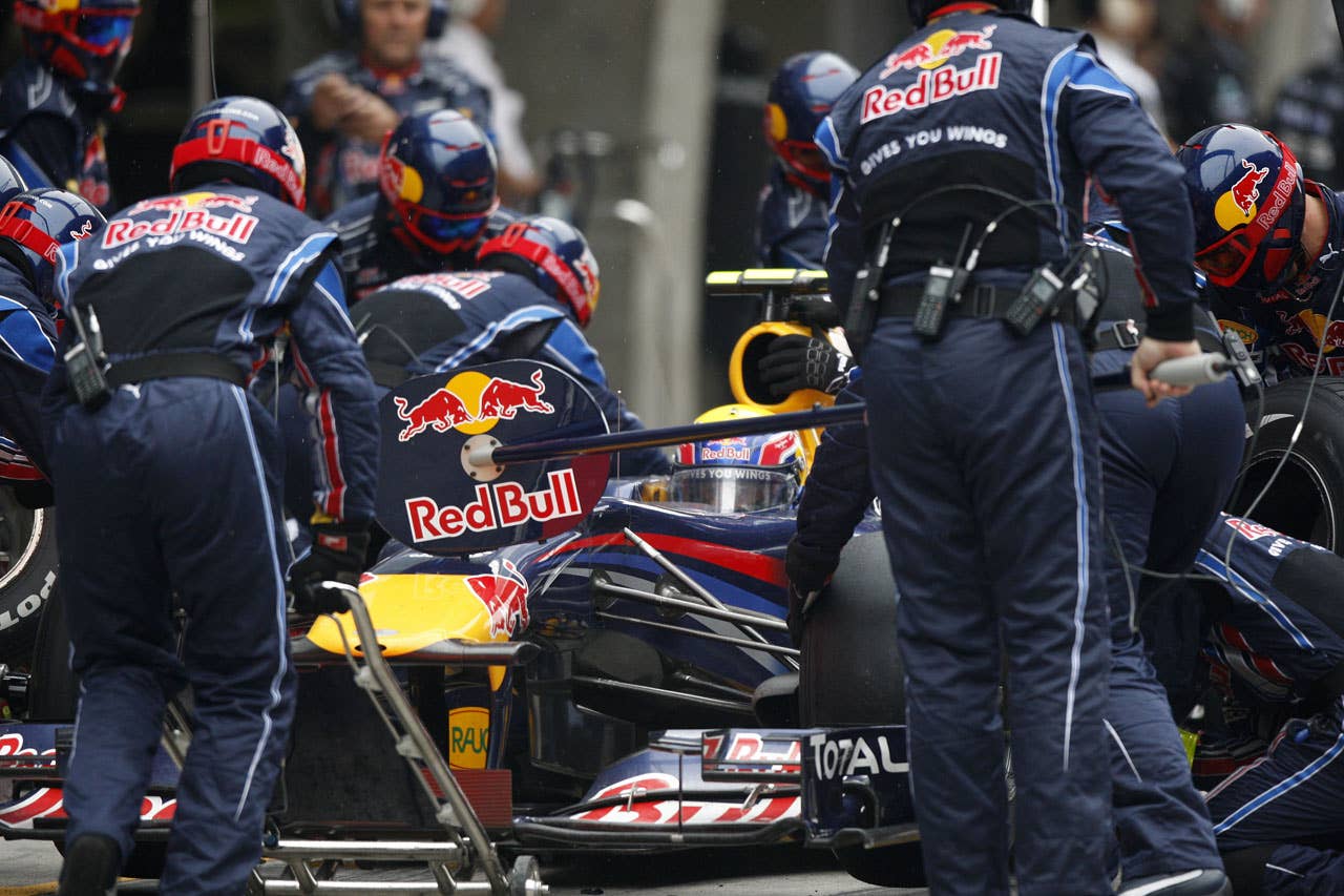 Red Bull-Renault driver Mark Webber of Australia takes his car in for a pit stop during the Formula One Chinese Grand Prix in Shanghai on April 18, 2010. Webber finished the race in eighth place.   AFP PHOTO / POOL (Photo credit should read STR/AFP/Getty Images)