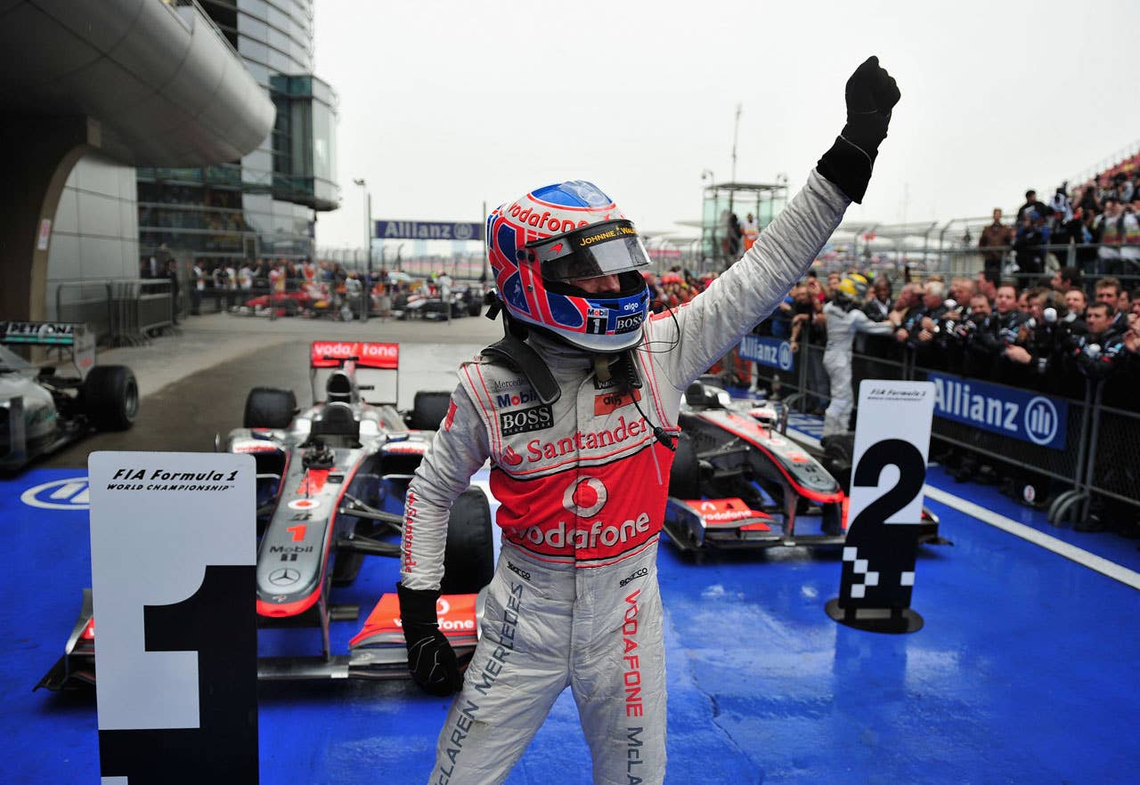 SHANGHAI, CHINA - APRIL 18:  Jenson Button of Great Britain and McLaren Mercedes celebrates in parc ferme after winning the Chinese Formula One Grand Prix at the Shanghai International Circuit on April 18, 2010 in Shanghai, China.  (Photo by Clive Mason/Getty Images) *** Local Caption *** Jenson Button
