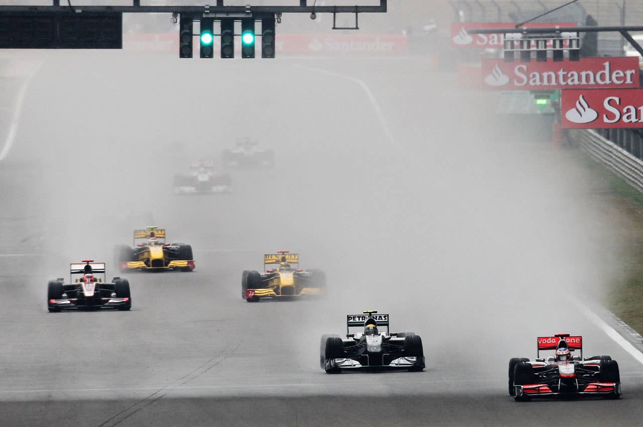 SHANGHAI, CHINA - APRIL 18:  Jenson Button (R) of Great Britain and McLaren Mercedes leads the field as he drives on his way to winning the Chinese Formula One Grand Prix at the Shanghai International Circuit on April 18, 2010 in Shanghai, China.  (Photo by Paul Gilham/Getty Images) *** Local Caption *** Jenson Button
