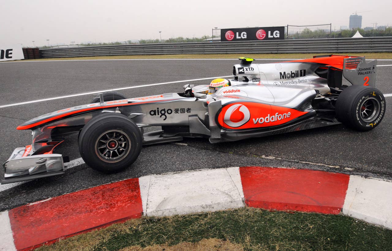 McLaren-Mercedes driver Lewis Hamilton of Britain takes his car into the pit lane during Formula One's Chinese Grand Prix in Shanghai on April 18, 2010. Hamilton finished the race in second place.   AFP PHOTO/GOH CHAI HIN (Photo credit should read GOH CHAI HIN/AFP/Getty Images)
