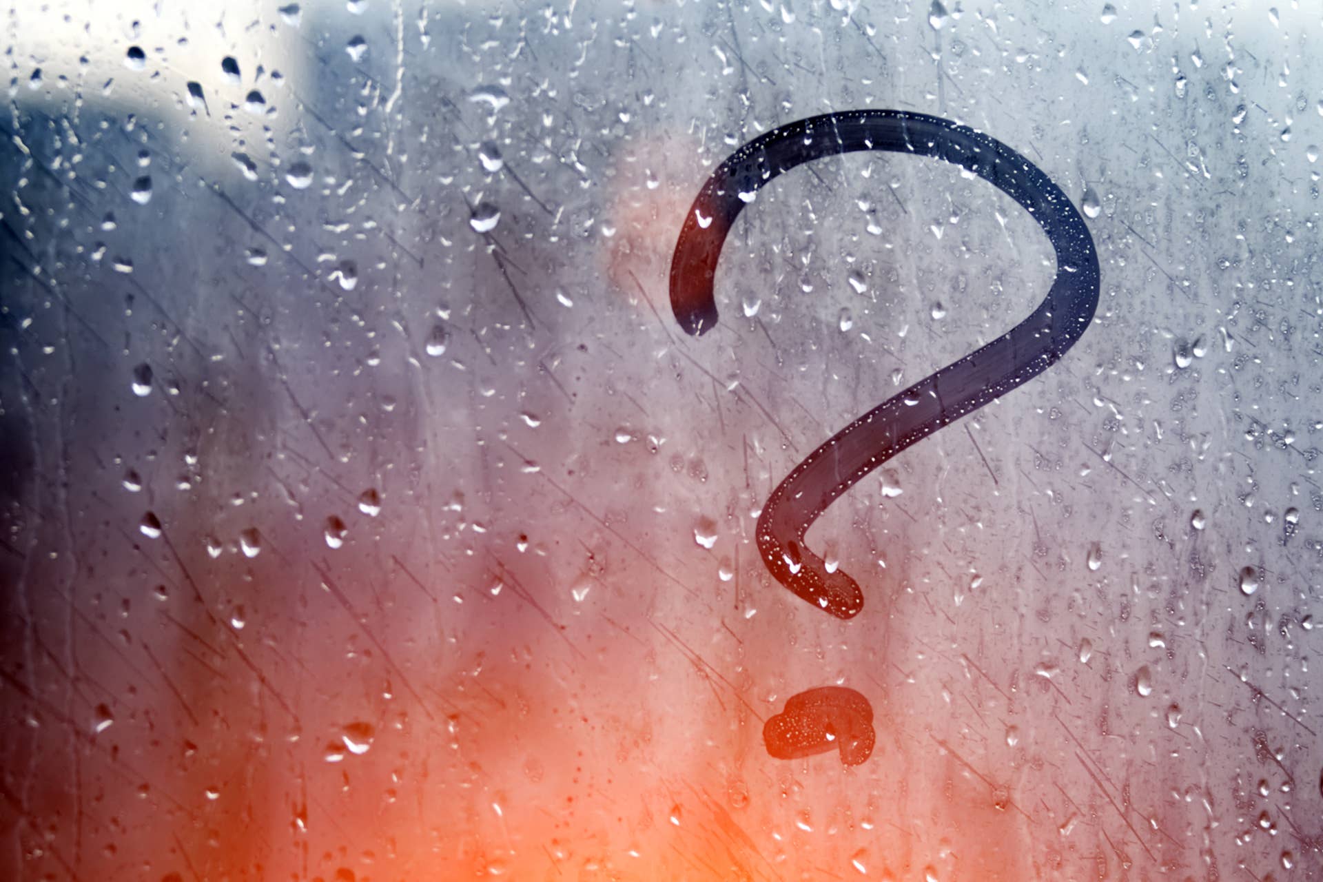 Autumn rain, the inscription on the sweaty glass - question mark
