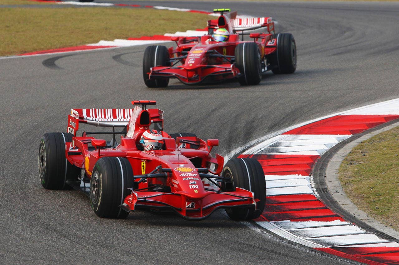 SHANGHAI, CHINA - OCTOBER 19: Kimi Raikkonen of Finland and Ferrari leads from team mate Felipe Massa of Brazil and Ferrari during the Chinese Formula One Grand Prix at the Shanghai International Circuit on October 19, 2008 in Shanghai, China. (Photo by Mark Thompson/Getty Images)