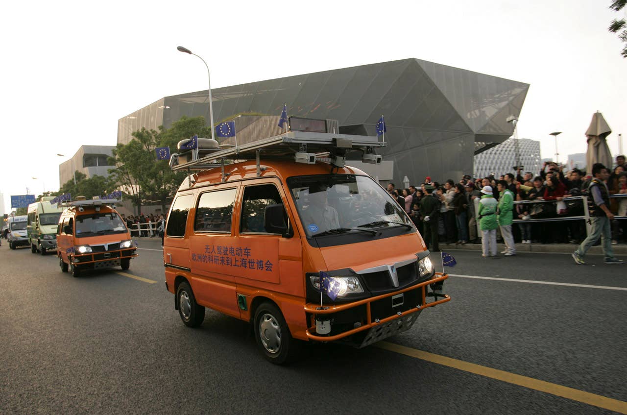 Two driverless vehicles, equipped with laser scanners and cameras to detect and help avoid obstacles, travels on the Shanghai Expo site to attend the official celebration of their arrival in Shanghai, China, Thursday Oct. 28, 2010. A team of Italian engineers launched the longest-ever test drive of driverless vehicles, a 13,000-kilometer (8,000-mile), three-month road trip from Italy to China. (AP Photo)