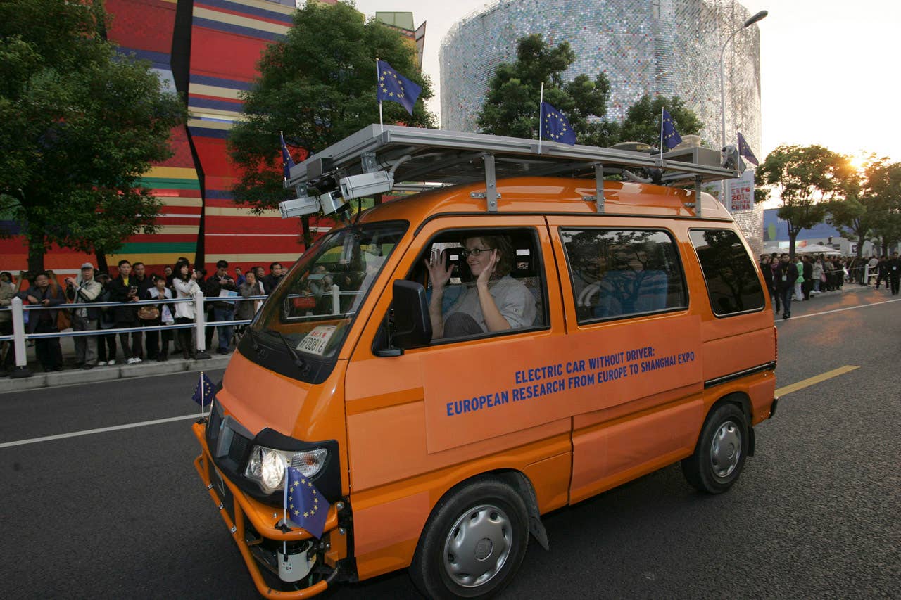 One of two driverless vehicles, equipped with laser scanners and cameras to detect and help avoid obstacles, travels on the Shanghai Expo site to attend the official celebration of their arrival in Shanghai, China, Thursday Oct. 28, 2010. A team of Italian engineers launched the longest-ever test drive of driverless vehicles, a 13,000-kilometer (8,000-mile), three-month road trip from Italy to China. (AP Photo)