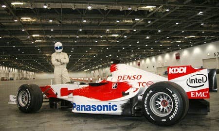 The Stig drives Toyota F1 car indoors