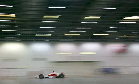 The Stig drives Toyota F1 car indoors