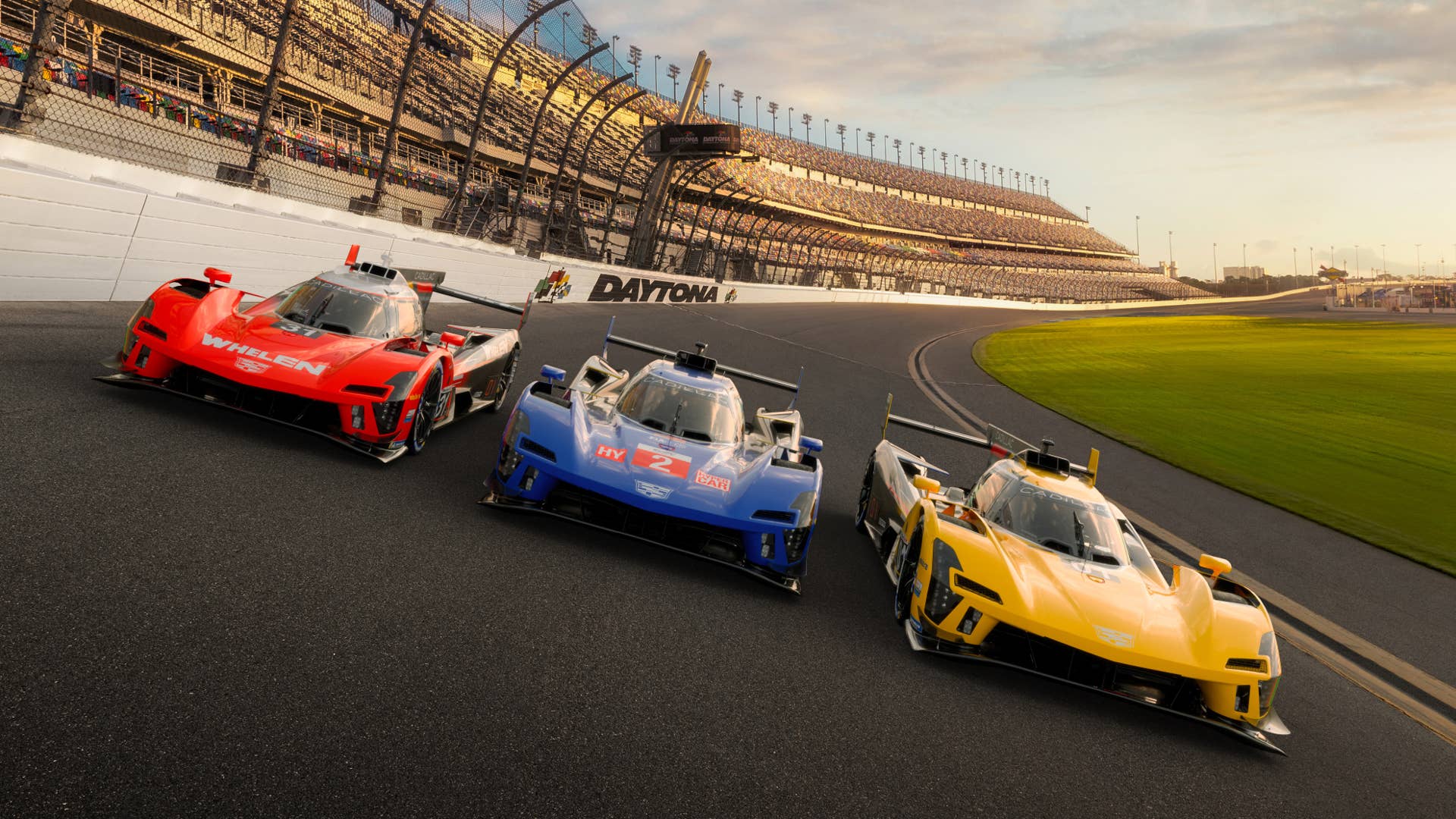 Cadillac V-LMDh race cars wearing their blue, red and gold liveries at Daytona International Speedway. Simulated vehicle shown.