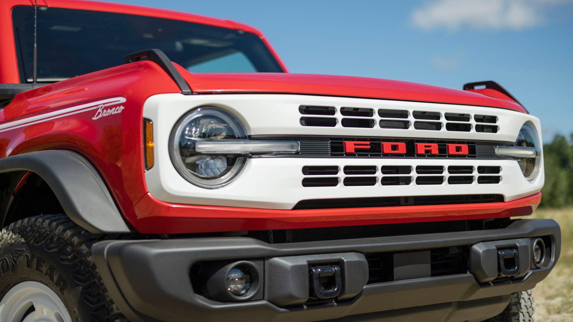 Bronco Heritage Edition available winter 2023. Limited availability. Preproduction models shown.  Always consult the Owner’s Manual before off-road driving, know your terrain and trail difficulty, and use appropriate safety gear.