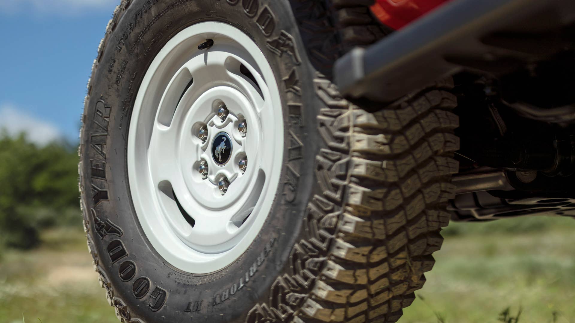 Bronco Heritage Edition available winter 2023. Limited availability. Preproduction models shown.  Always consult the Owner’s Manual before off-road driving, know your terrain and trail difficulty, and use appropriate safety gear.