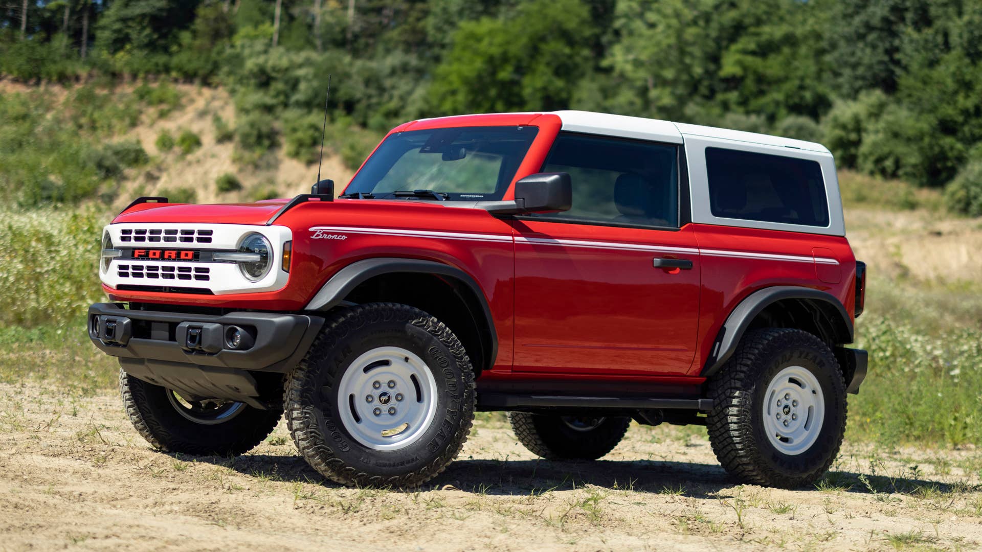 Bronco Heritage Edition available winter 2023. Limited availability. Preproduction models shown.  Always consult the Owner’s Manual before off-road driving, know your terrain and trail difficulty, and use appropriate safety gear.