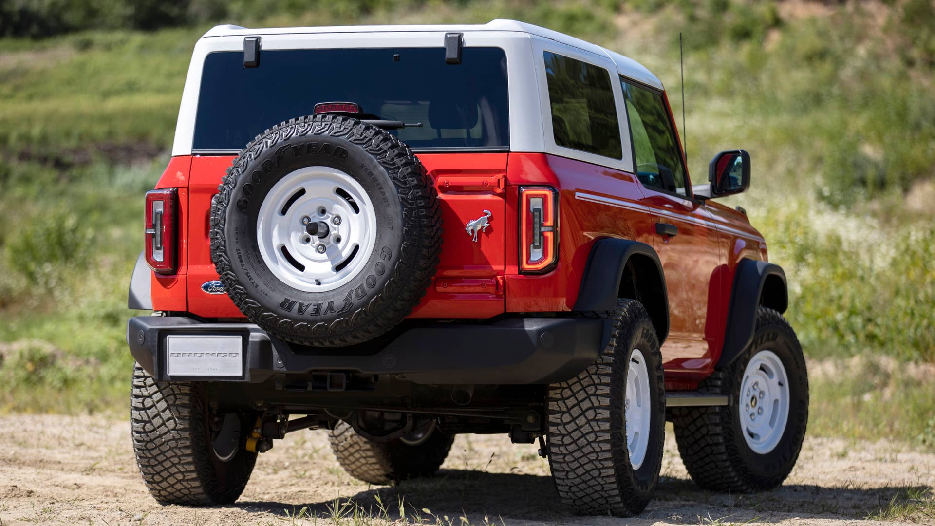 Bronco Heritage Edition available winter 2023. Limited availability. Preproduction models shown.  Always consult the Owner’s Manual before off-road driving, know your terrain and trail difficulty, and use appropriate safety gear.