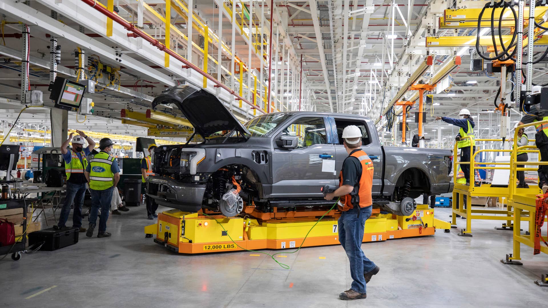 One year after Ford confirmed construction of the Rouge Electric Vehicle Center in Dearborn, Mich., the first Ford F-150 Lightning pre-production units begin leaving the factory. Pre-production model shown. F-150 Lightning available starting spring 2022.