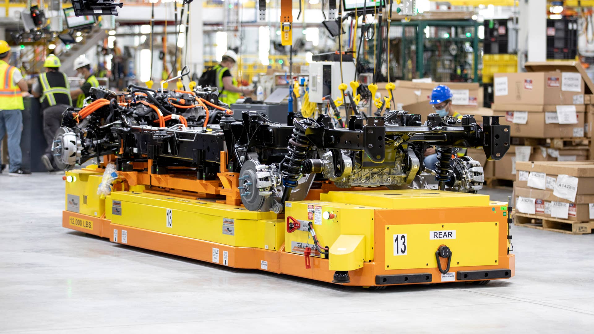 One year after Ford confirmed construction of the Rouge Electric Vehicle Center in Dearborn, Mich., the first Ford F-150 Lightning pre-production units begin leaving the factory. Pre-production model shown. F-150 Lightning available starting spring 2022.