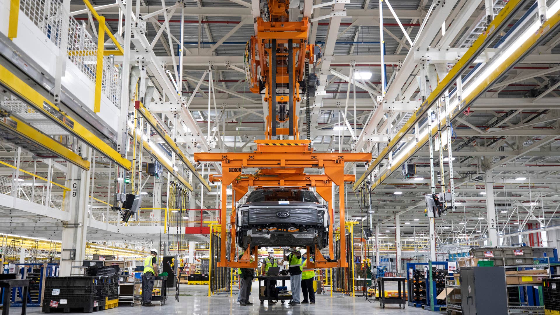 One year after Ford confirmed construction of the Rouge Electric Vehicle Center in Dearborn, Mich., the first Ford F-150 Lightning pre-production units begin leaving the factory. Pre-production model shown. F-150 Lightning available starting spring 2022.