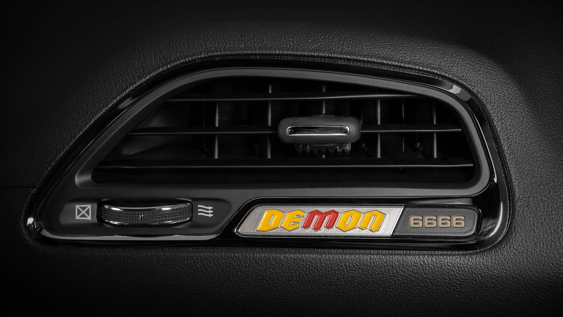 A yellow and red Demon instrument panel badge calls out the four-digit vehicle VIN number.