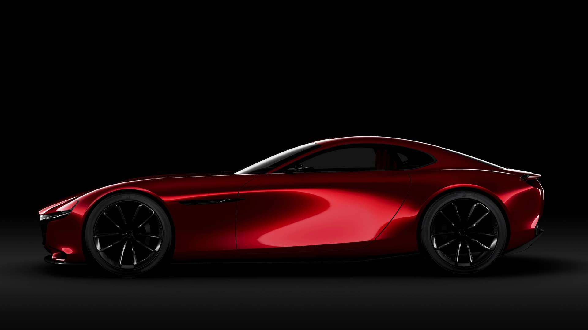 red mazda rx-vision concept black background