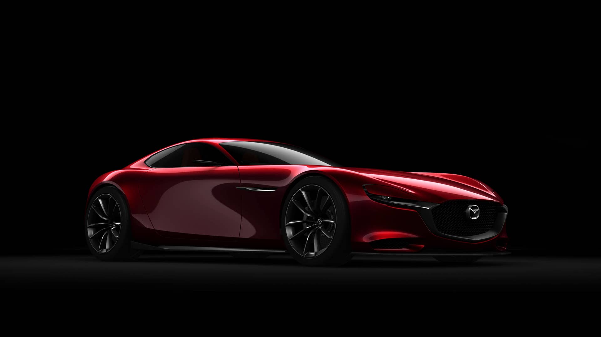 red mazda rx-vision concept three quarters black background