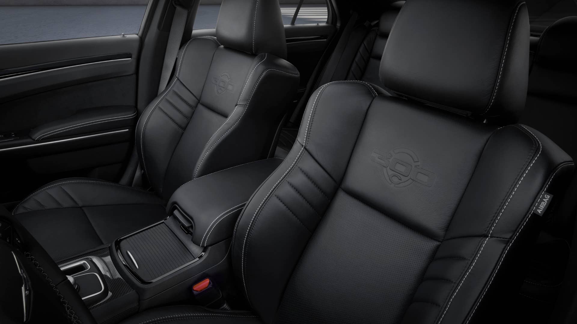 Black Laguna leather front seats of the 2023 Chrysler 300C are embossed with the new 300C logo and further accented with unique silver stitching.