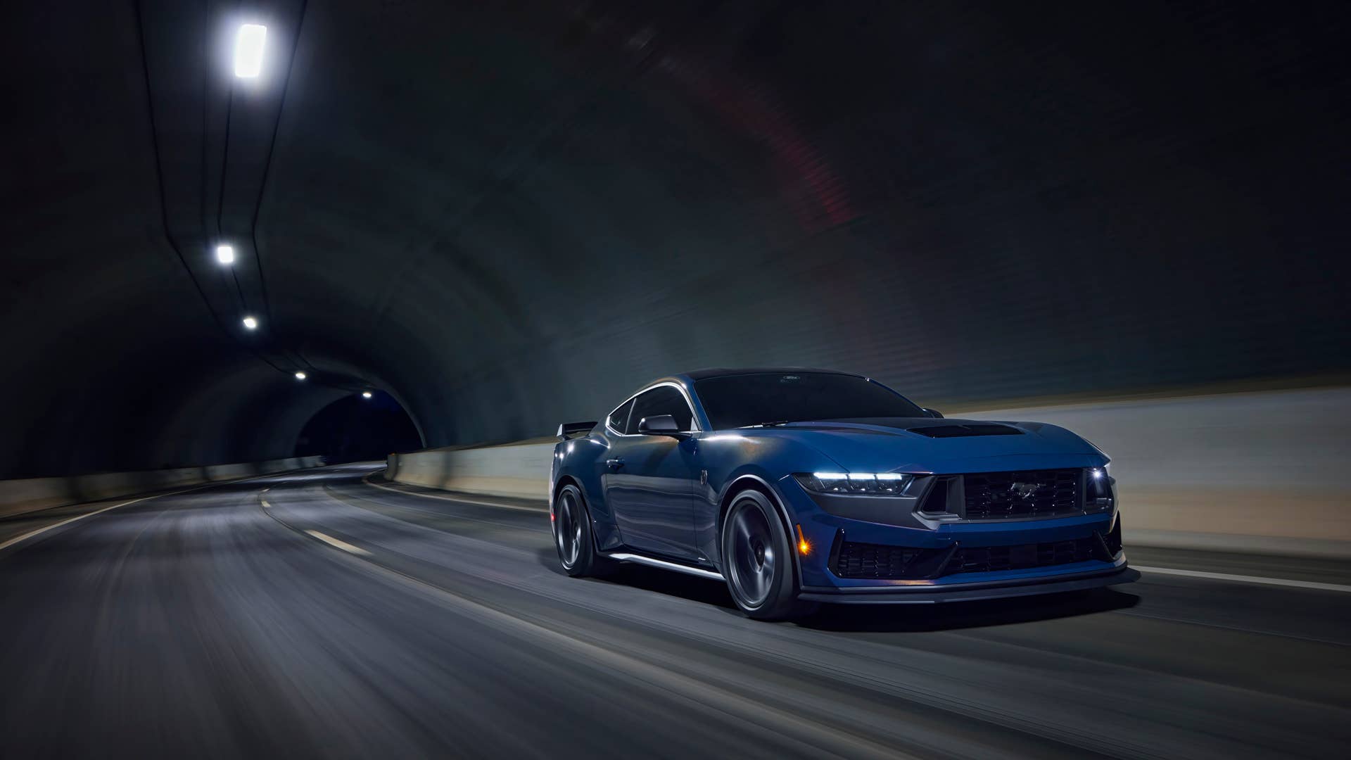 With sinister looks and a specially modified 5.0-liter V8 – the most powerful 5.0-liter V8 ever, projecting 500 horsepower – Dark Horse expands the Mustang lineup and sets a new benchmark for American street and track performance that could only come in a Mustang. Pre-production vehicles shown. Closed course. Professional driver.