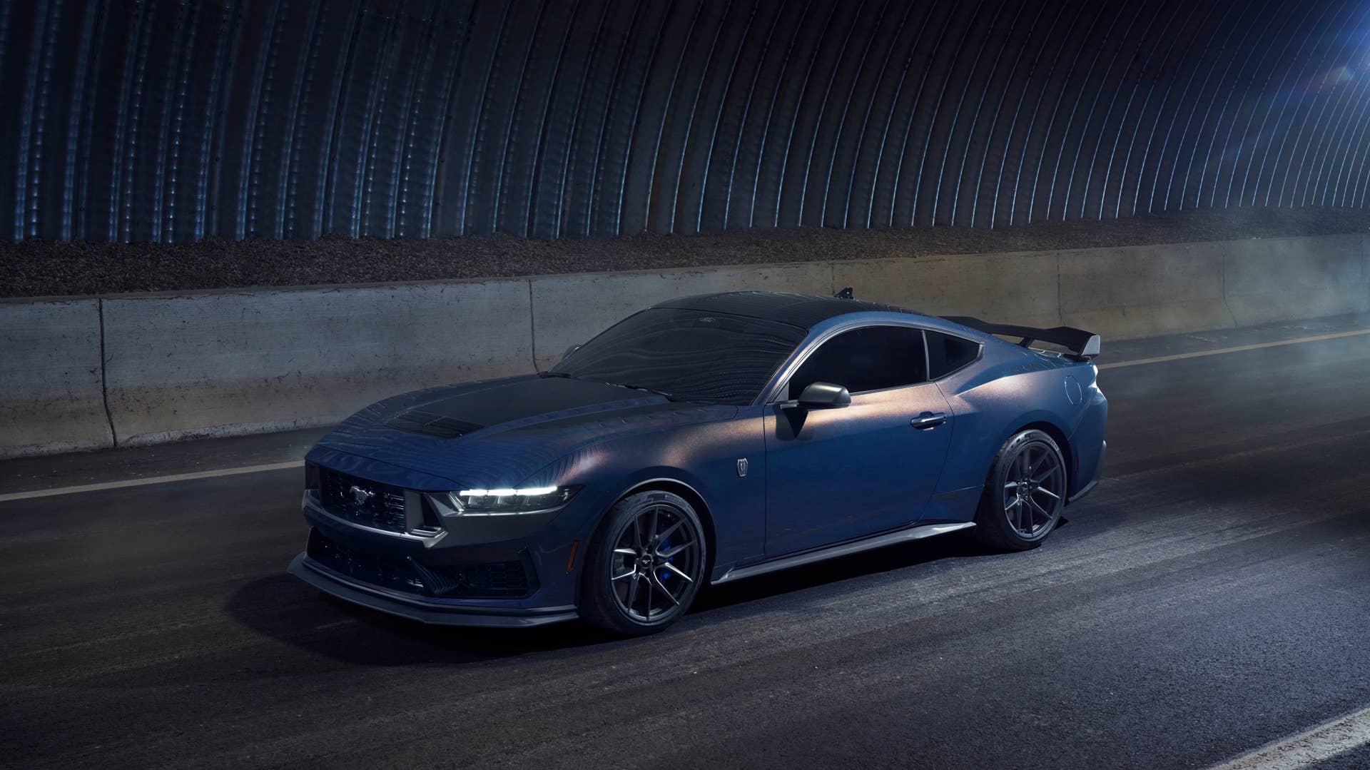 With sinister looks and a specially modified 5.0-liter V8 – the most powerful 5.0-liter V8 ever, projecting 500 horsepower – Dark Horse expands the Mustang lineup and sets a new benchmark for American street and track performance that could only come in a Mustang. Pre-production vehicles shown.