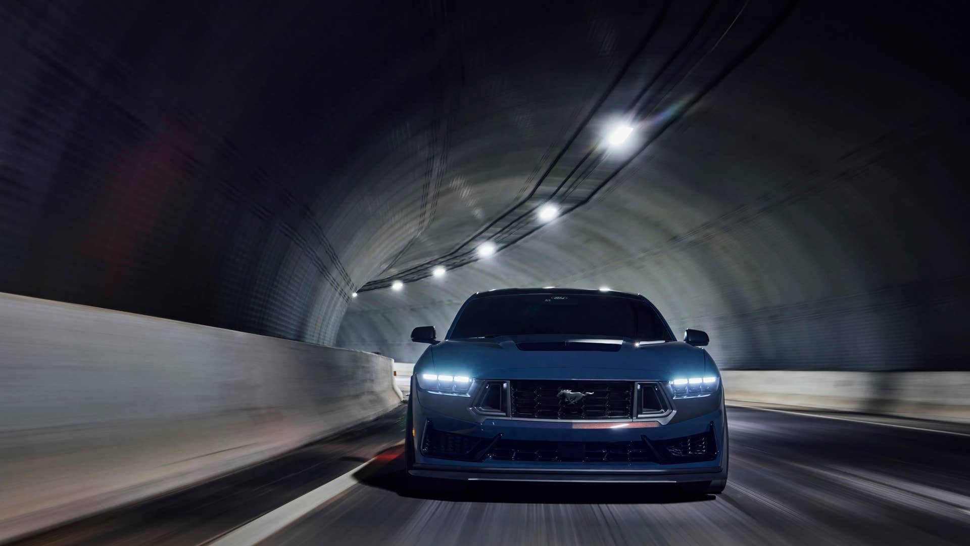 With sinister looks and a specially modified 5.0-liter V8 – the most powerful 5.0-liter V8 ever, projecting 500 horsepower – Dark Horse expands the Mustang lineup and sets a new benchmark for American street and track performance that could only come in a Mustang. Pre-production vehicles shown. Closed course. Professional driver.
