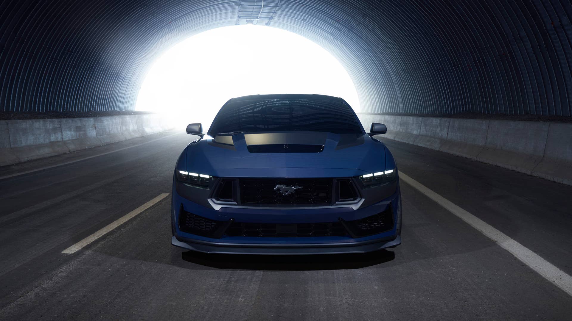 With sinister looks and a specially modified 5.0-liter V8 – the most powerful 5.0-liter V8 ever, projecting 500 horsepower – Dark Horse expands the Mustang lineup and sets a new benchmark for American street and track performance that could only come in a Mustang. Pre-production vehicles shown.