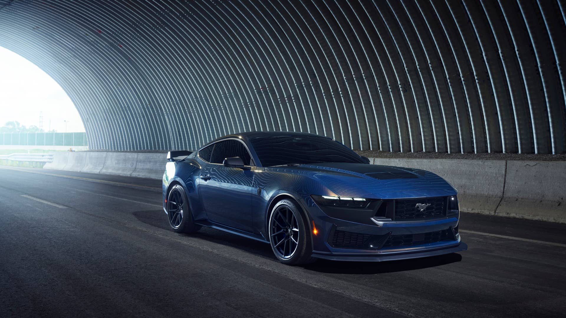 With sinister looks and a specially modified 5.0-liter V8 – the most powerful 5.0-liter V8 ever, projecting 500 horsepower – Dark Horse expands the Mustang lineup and sets a new benchmark for American street and track performance that could only come in a Mustang. Pre-production vehicles shown.