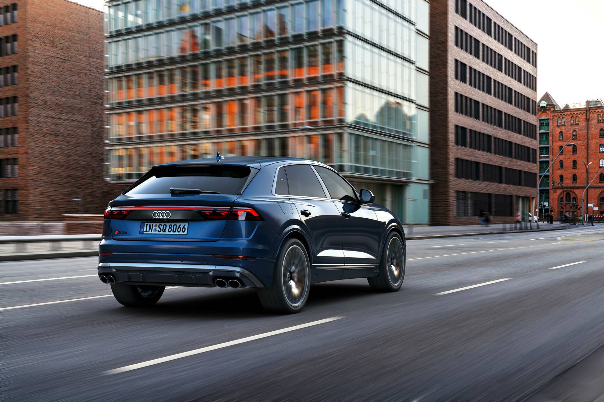 2024 Audi SQ8 blue rear angled view driving