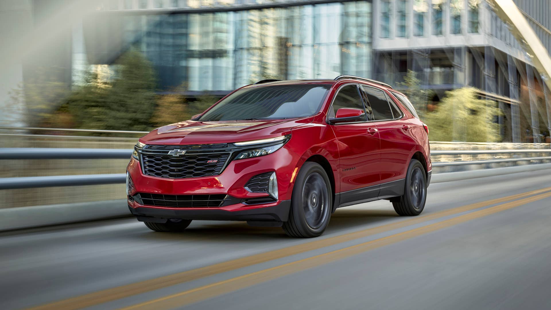 Front 3/4 view of 2024 Chevrolet Equinox RS in Radiant Red Tintcoat.