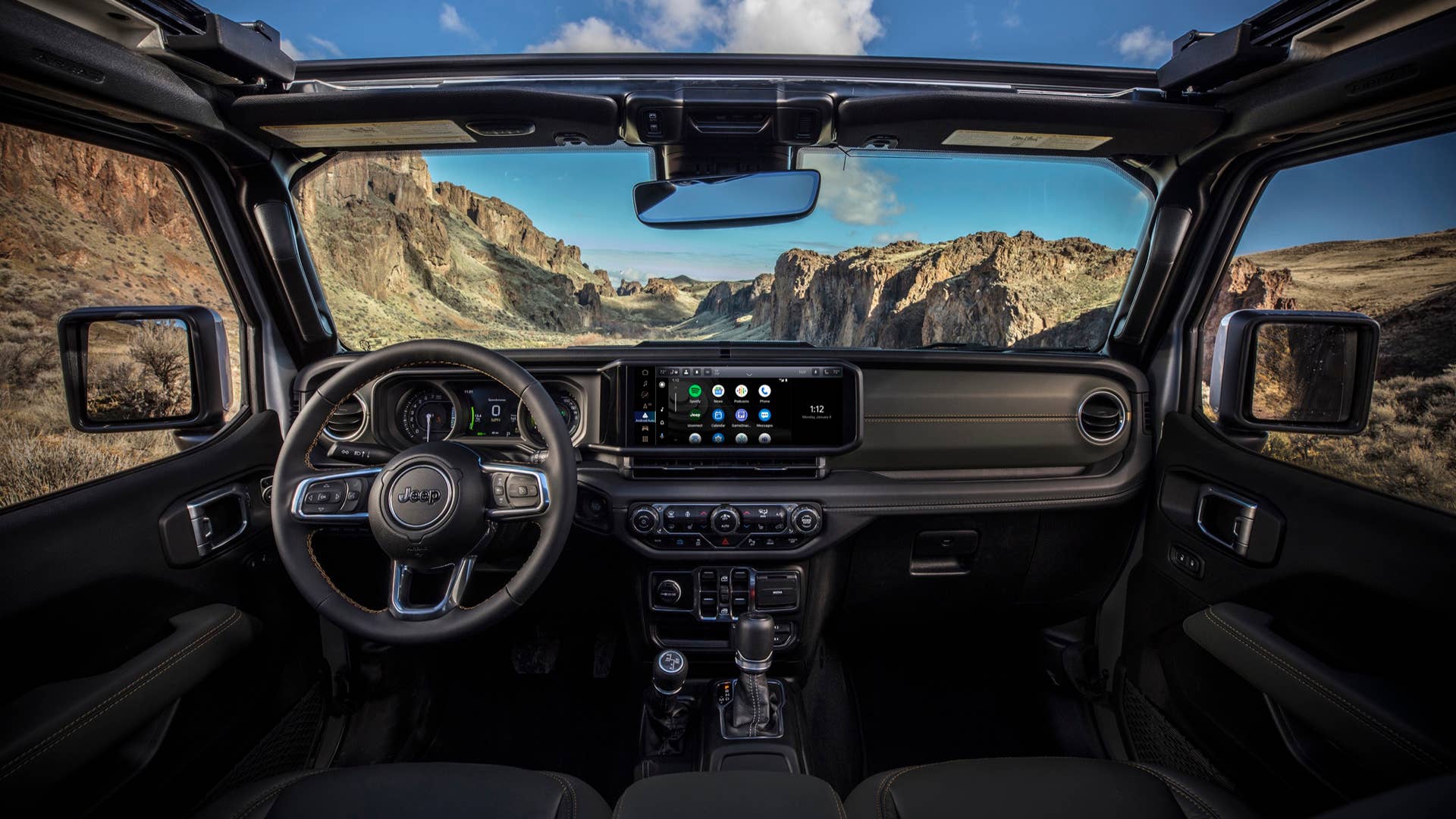 New 2024 Jeep® Wrangler High Altitude 4xe with 12-way power adjustable front seats and all-new instrument panel featuring Uconnect 5 system with best-in-class 12.3-inch touchscreen radio