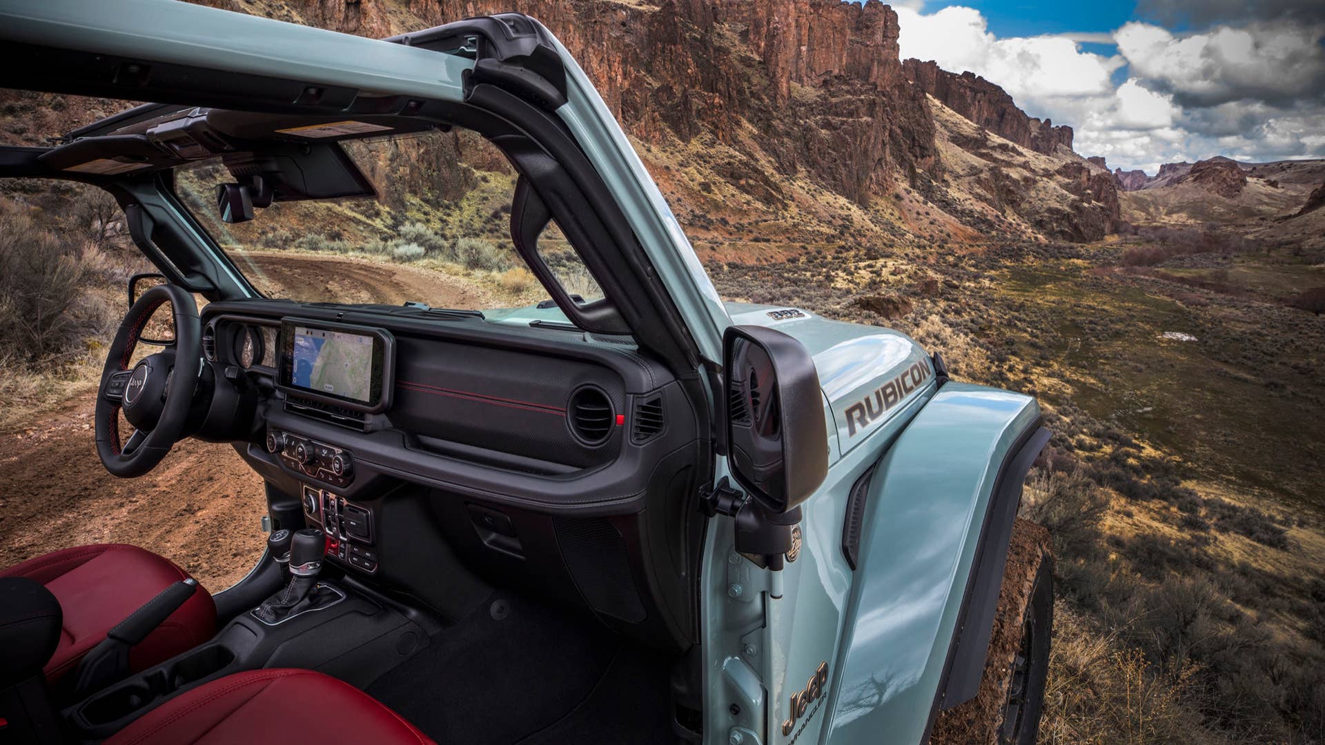 New 2024 Jeep® Wrangler Rubicon X 4xe with 12-way power adjustable front seats and all-new instrument panel featuring Uconnect 5 system with best-in-class 12.3-inch touchscreen radio