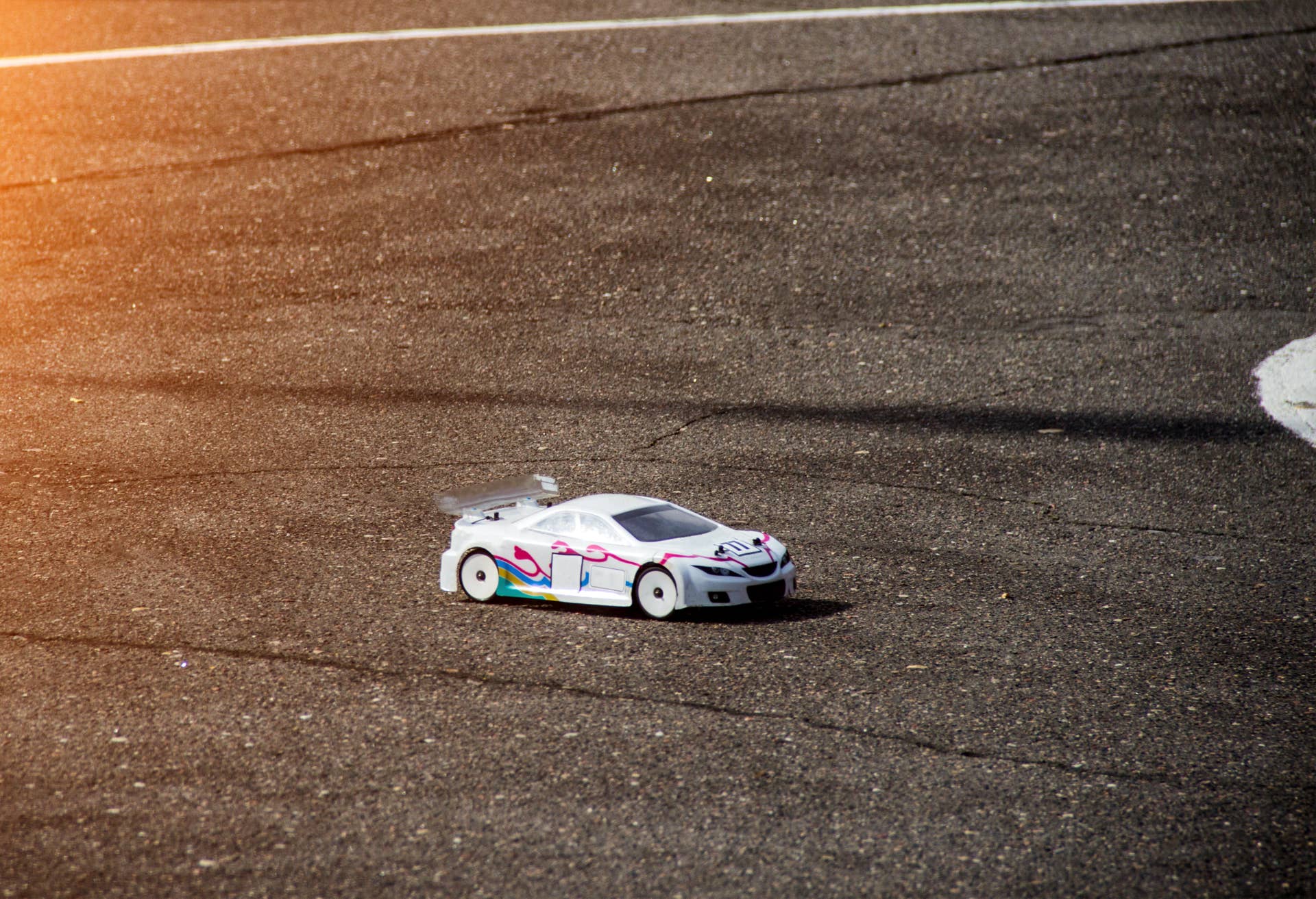 car sport, radio-controlled car moving along the asphalt road, car sport competition, rally