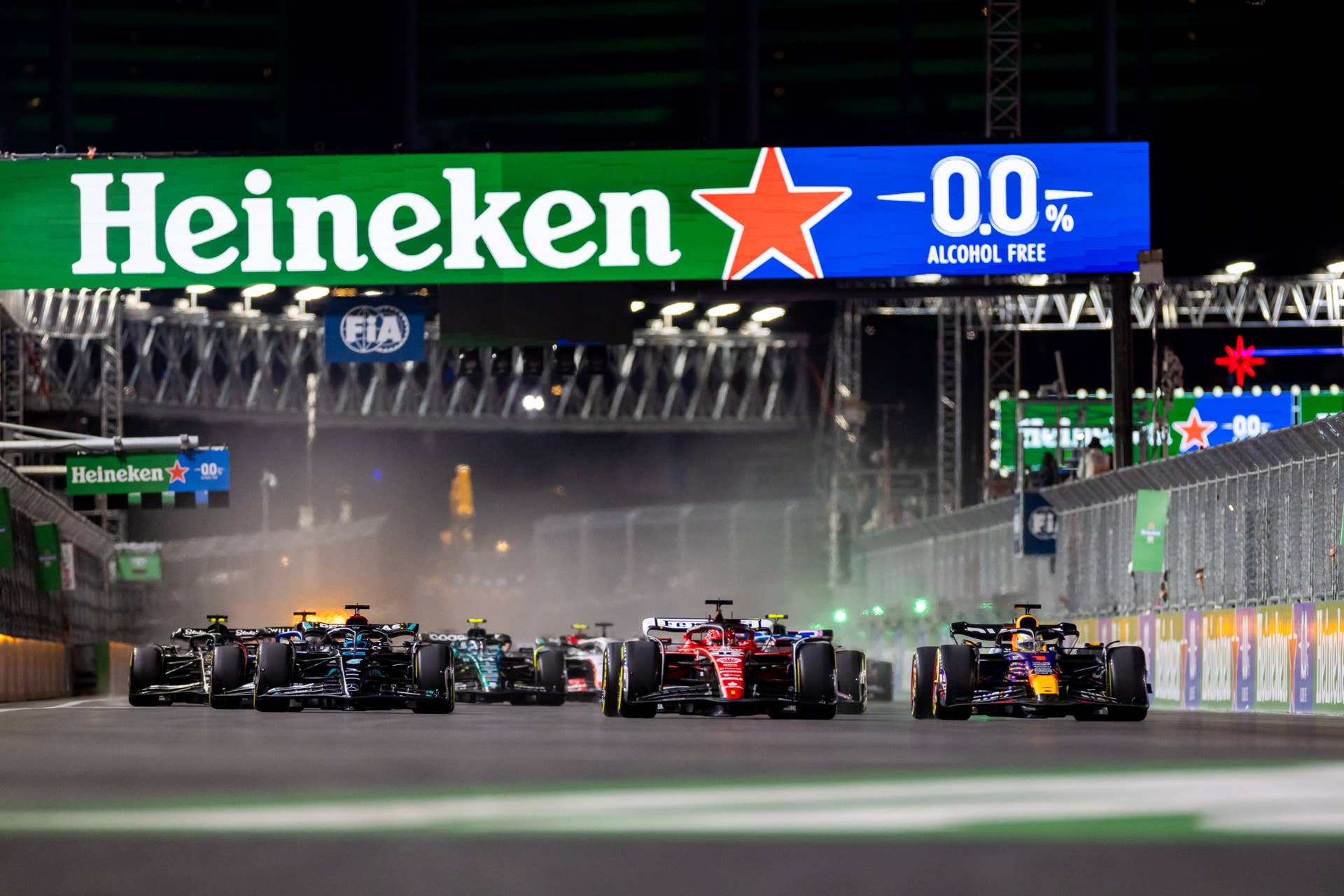 LAS VEGAS, NV - NOVEMBER 18: Red Bull Racing driver Max Verstappen (1) of the Netherlands and Ferrari driver Charles Leclerc (16) of Monaco lead at the start during the F1 Las Vegas Grand Prix on Saturday, November 18, 2023 on the Las Vegas Street Circuit in Las Vegas, NV. (Photo by Bob Kupbens/Icon Sportswire via Getty Images)