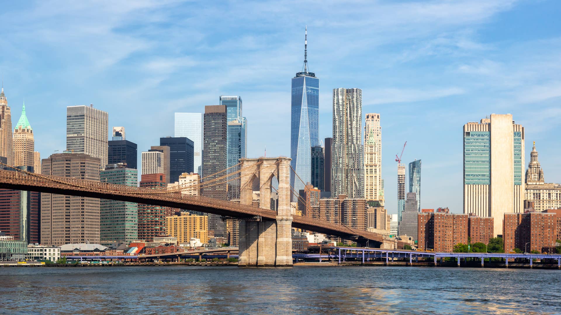 New York City skyline of Manhattan with Brooklyn Bridge and World Trade Center skyscraper panorama traveling in the United States