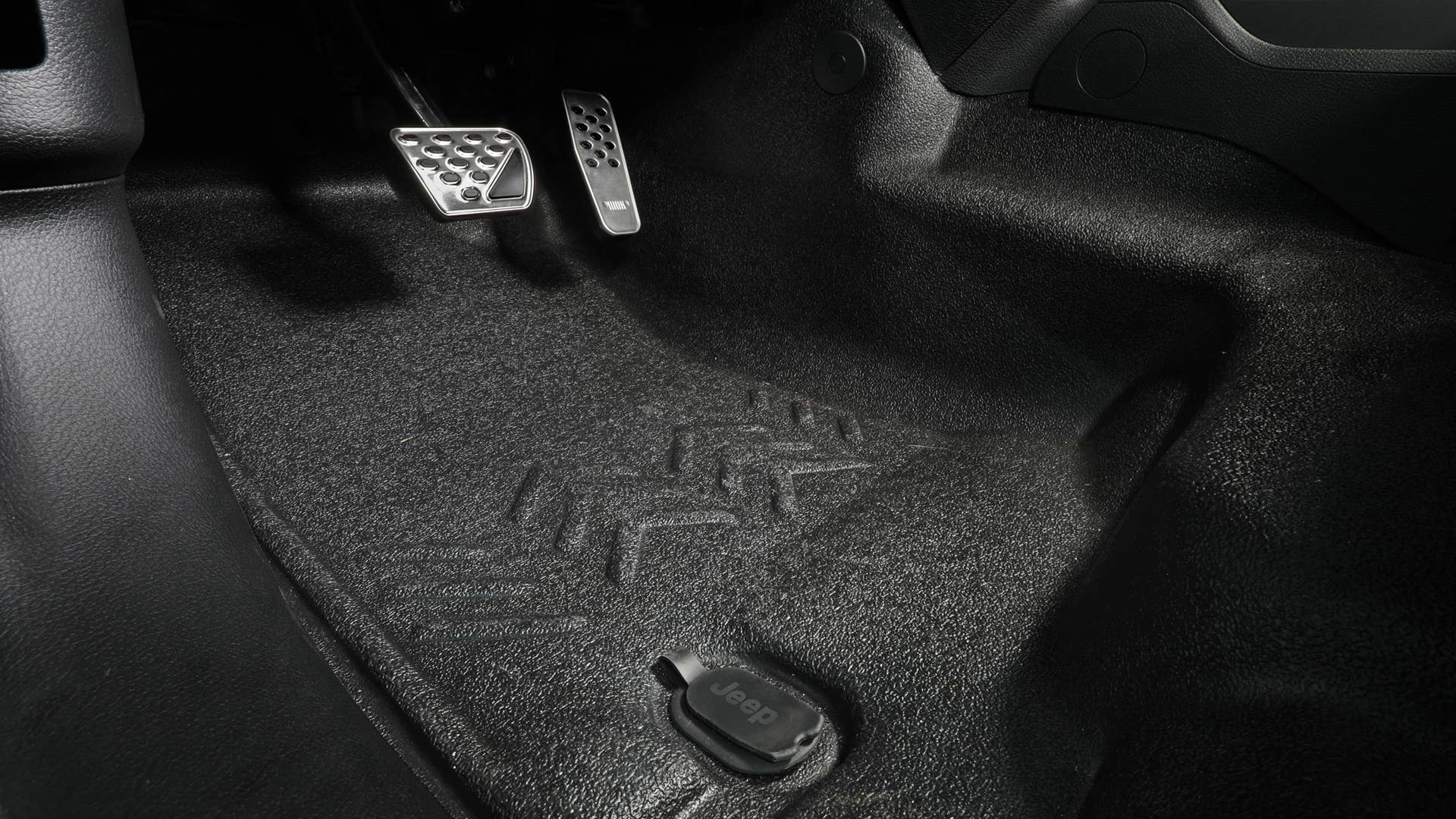 The Jeep® Performance Parts Heavy-duty flooring system uses a multi-layer construction offering thermal protection, sound dampening and a rugged surface for any potential situation. The design incorporates water removal via integrated floor drains.